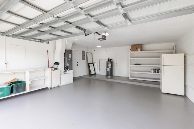 garage featuring water heater, a garage door opener, freestanding refrigerator, and electric panel