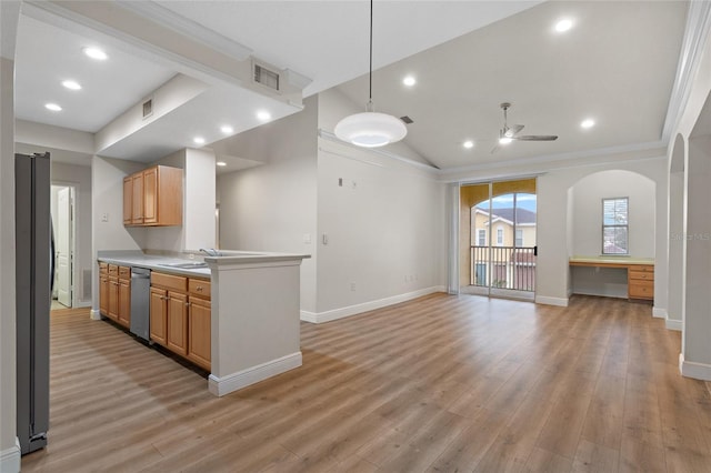 kitchen with built in desk, light countertops, stainless steel dishwasher, light wood-style floors, and freestanding refrigerator