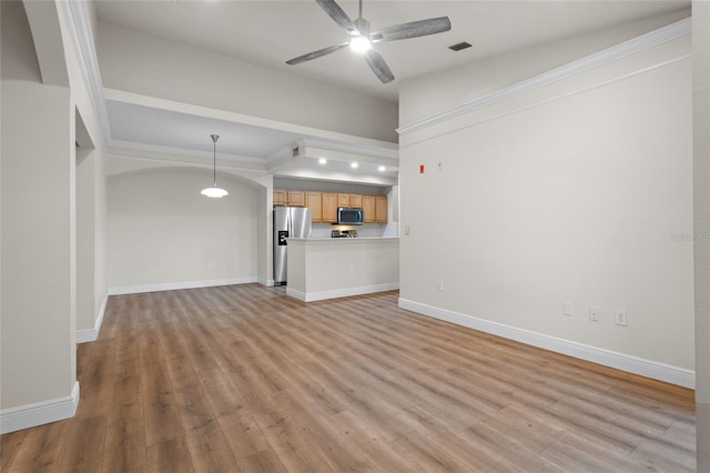 unfurnished living room featuring ceiling fan, baseboards, visible vents, and light wood-style floors