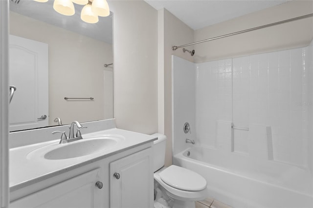 bathroom featuring washtub / shower combination, vanity, toilet, and tile patterned floors