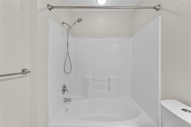 bathroom with toilet and shower / washtub combination