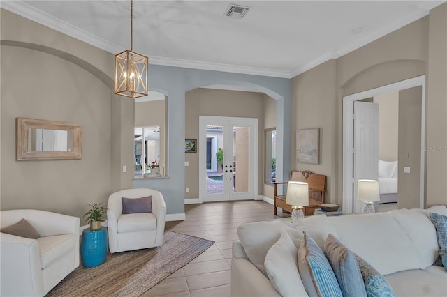 tiled living room with ornamental molding, an inviting chandelier, visible vents, and baseboards