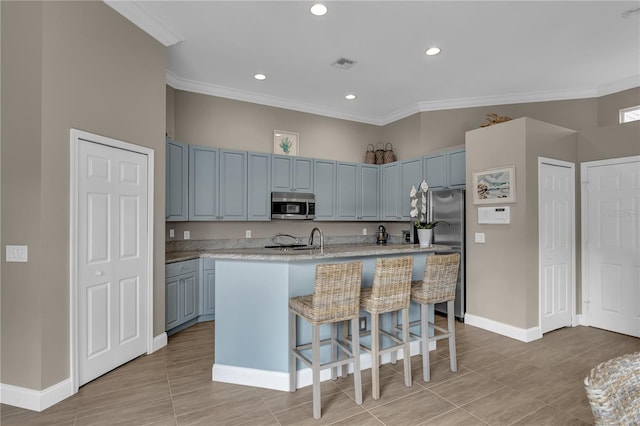 kitchen with stainless steel appliances, light countertops, visible vents, and ornamental molding