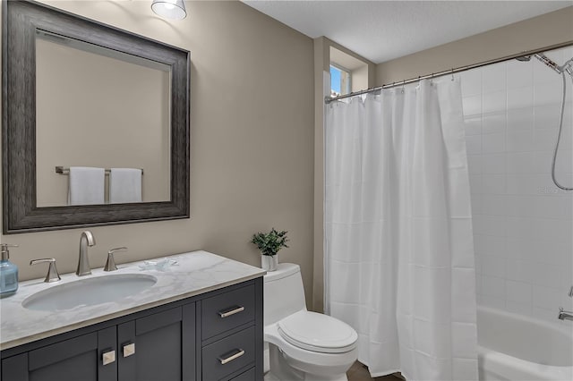 full bath with a textured ceiling, vanity, toilet, and shower / bathtub combination with curtain