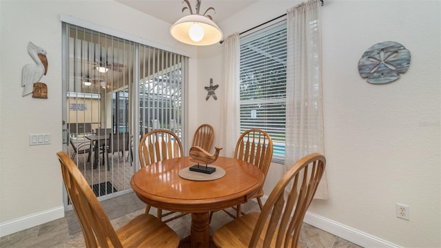 dining area featuring baseboards