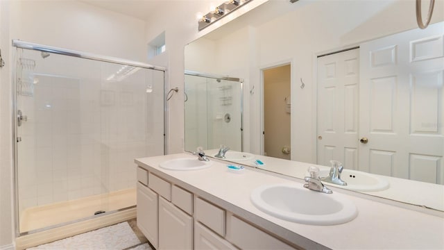 bathroom featuring a stall shower, a sink, and toilet