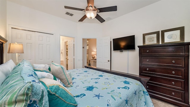 bedroom featuring ceiling fan, a closet, visible vents, and light colored carpet