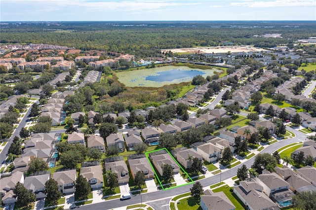 birds eye view of property with a water view and a residential view