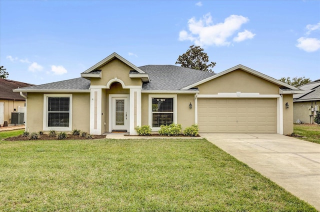 view of front of property featuring a garage, concrete driveway, a front yard, and stucco siding