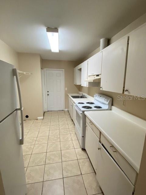 kitchen featuring light countertops, white cabinets, a sink, white appliances, and under cabinet range hood