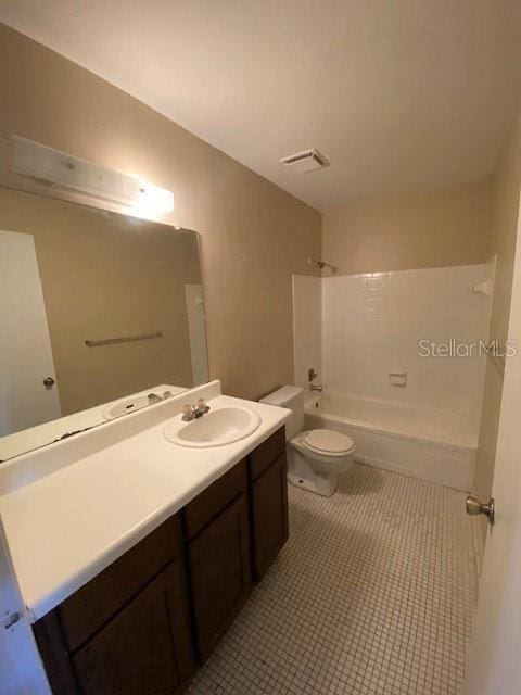 full bathroom with visible vents, toilet, shower / tub combination, tile patterned floors, and vanity