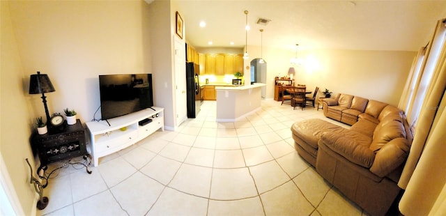 living room featuring light tile patterned floors, visible vents, and recessed lighting