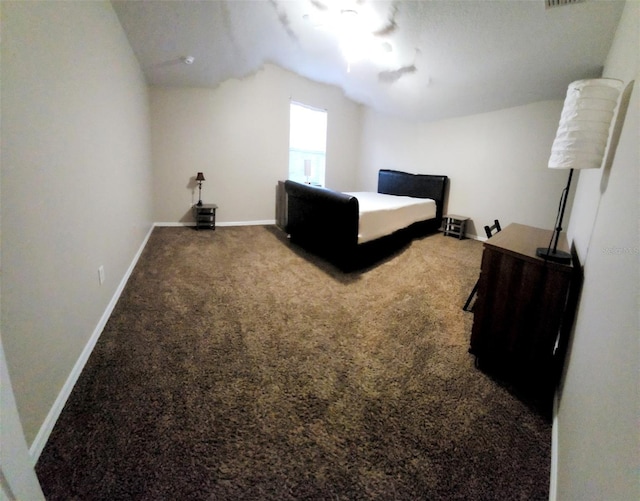 carpeted bedroom with ceiling fan and baseboards