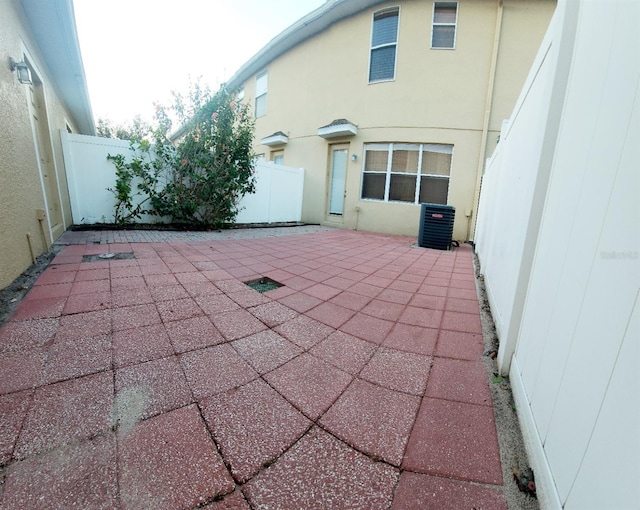 view of patio / terrace featuring central AC and a fenced backyard