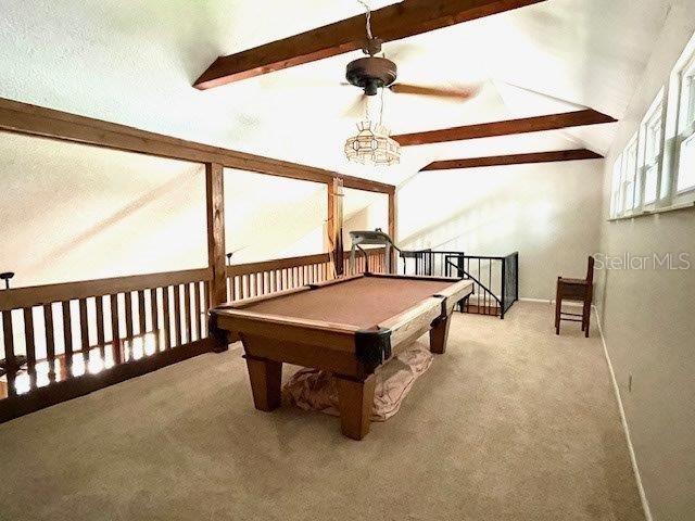 rec room featuring carpet, pool table, and vaulted ceiling with beams