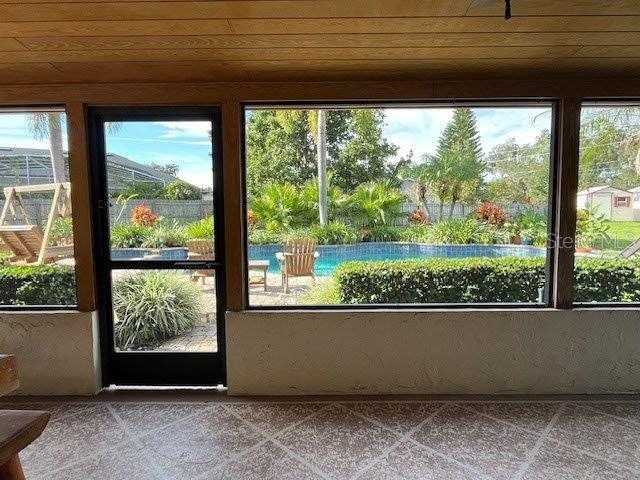 unfurnished sunroom featuring a healthy amount of sunlight