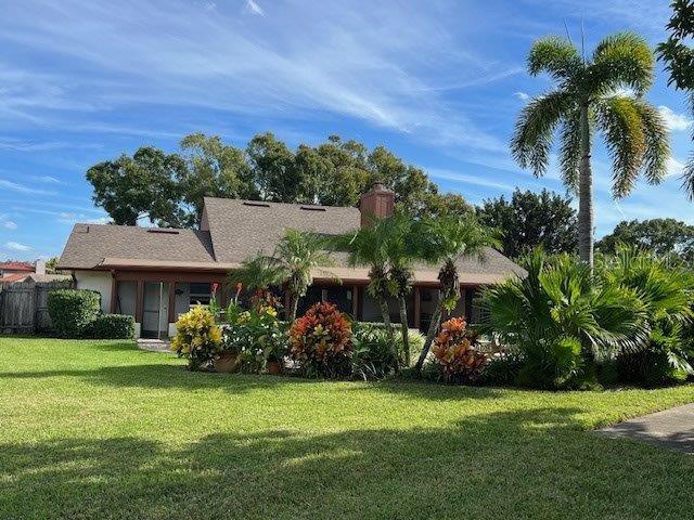 single story home with fence and a front yard