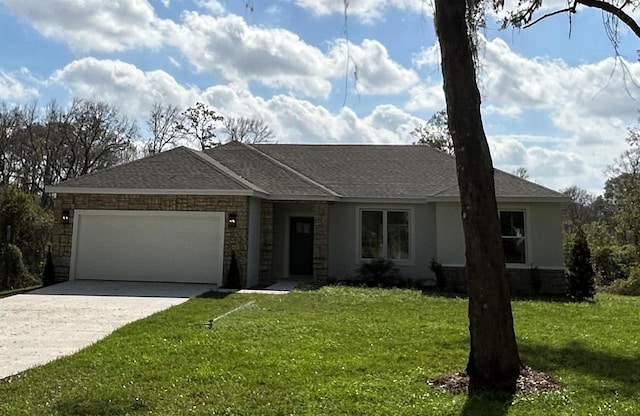 single story home with an attached garage, a shingled roof, concrete driveway, stone siding, and a front lawn