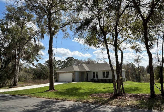 single story home featuring an attached garage, driveway, and a front lawn