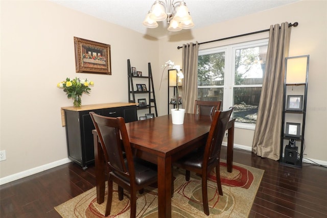 dining area with an inviting chandelier, baseboards, and dark wood finished floors