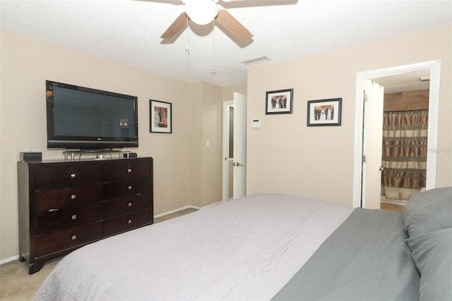 bedroom featuring visible vents, ceiling fan, light carpet, and baseboards