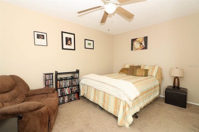 bedroom with ceiling fan, baseboards, and light colored carpet