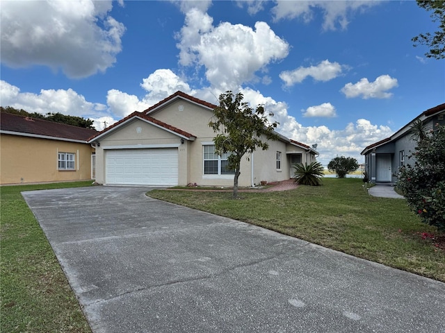 view of front of house with an attached garage, stucco siding, concrete driveway, and a front yard