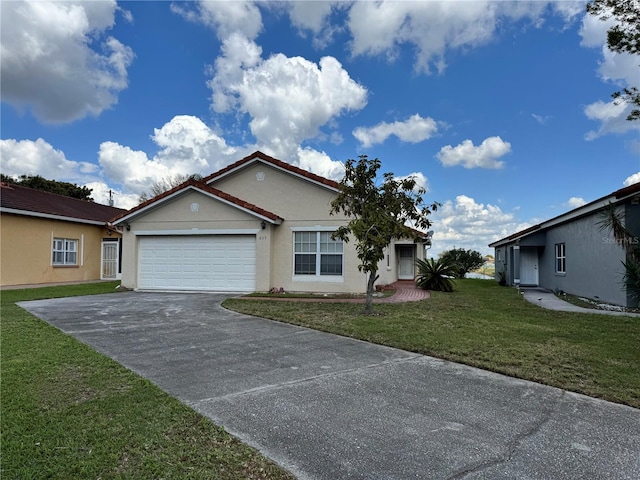 ranch-style house with concrete driveway, a front lawn, an attached garage, and stucco siding