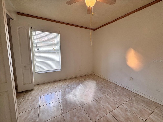 spare room with light tile patterned flooring, crown molding, and ceiling fan