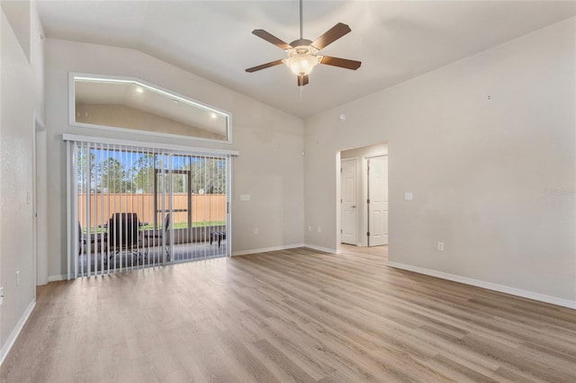 unfurnished room featuring a ceiling fan, lofted ceiling, light wood-style flooring, and baseboards