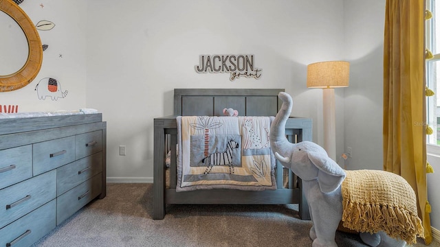 bedroom with carpet flooring and baseboards