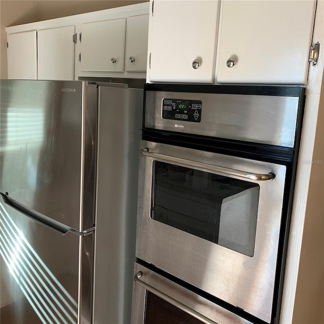 kitchen with white cabinetry and stainless steel appliances