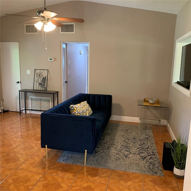 tiled living area with visible vents, ceiling fan, baseboards, and lofted ceiling