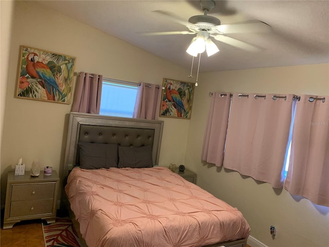 bedroom featuring lofted ceiling and ceiling fan