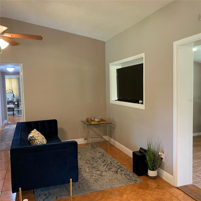 217 Wilmer Ave, Orlando, FL 32811 - tiled living room with baseboards and ceiling fan