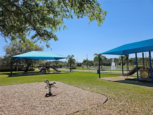 exterior space featuring a lawn and playground community