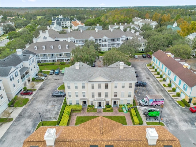 birds eye view of property with a residential view