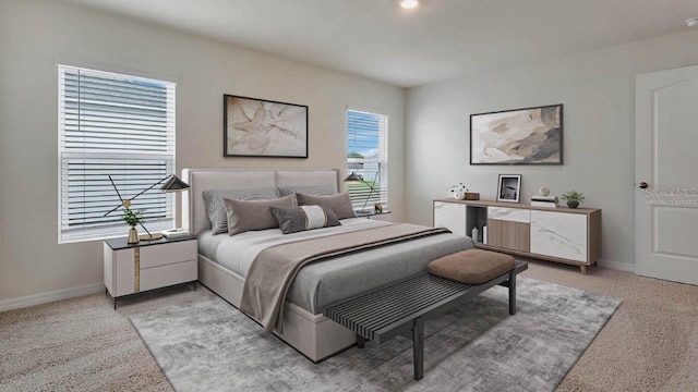 bedroom featuring light colored carpet and baseboards