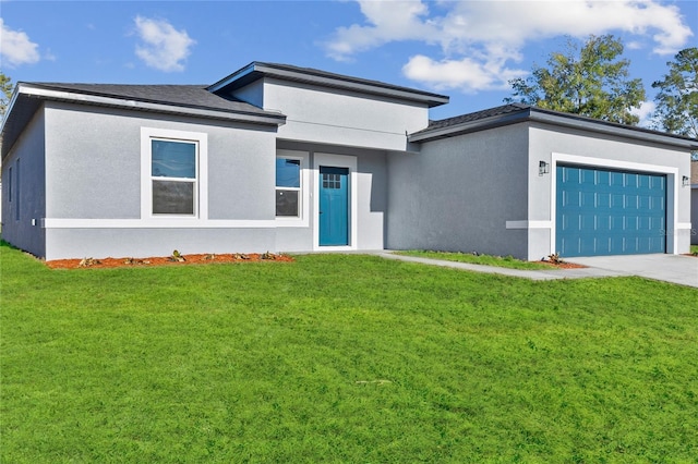 view of front of property featuring a garage, a front lawn, and stucco siding