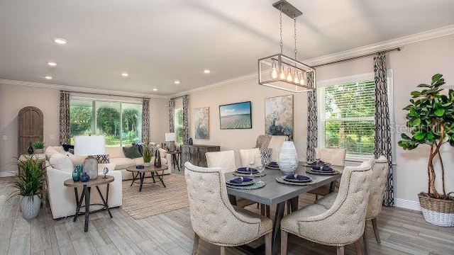 dining space with ornamental molding and a wealth of natural light