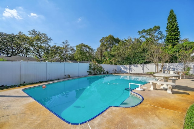 view of pool featuring a patio area, a fenced backyard, and a fenced in pool