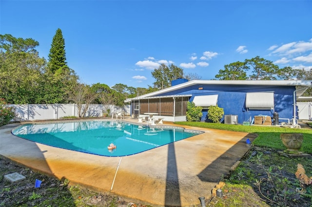 view of pool featuring a patio area, a fenced backyard, a fenced in pool, and cooling unit