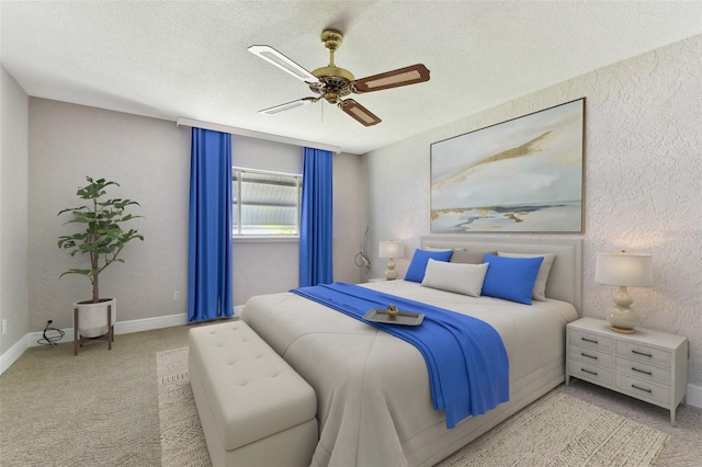 bedroom with baseboards, a ceiling fan, a textured wall, carpet, and a textured ceiling