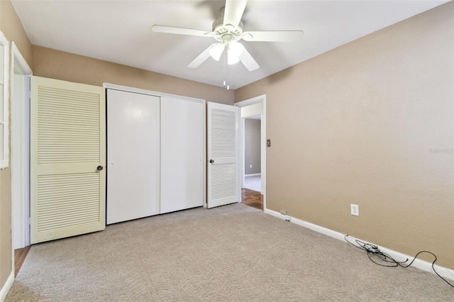 unfurnished bedroom featuring ceiling fan, a closet, carpet flooring, and baseboards