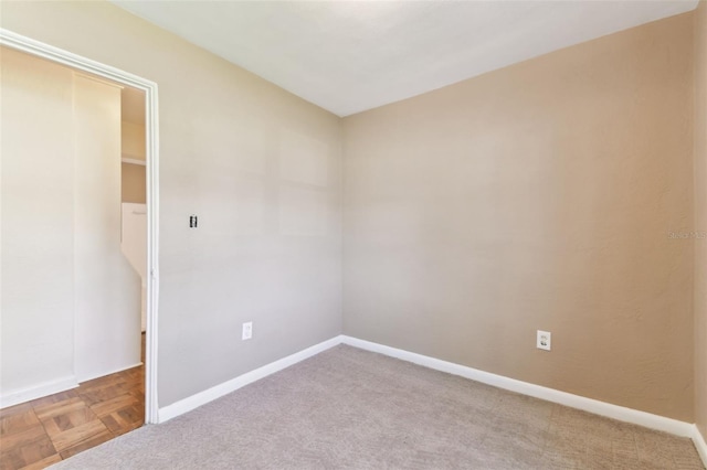 empty room with baseboards