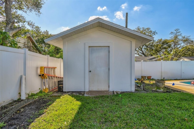 view of shed with a fenced backyard