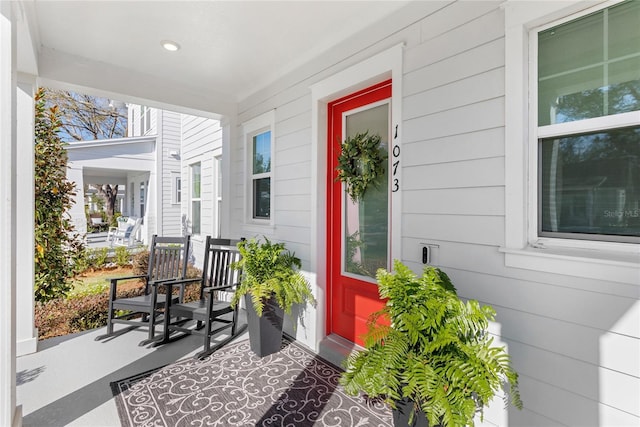 entrance to property featuring a porch