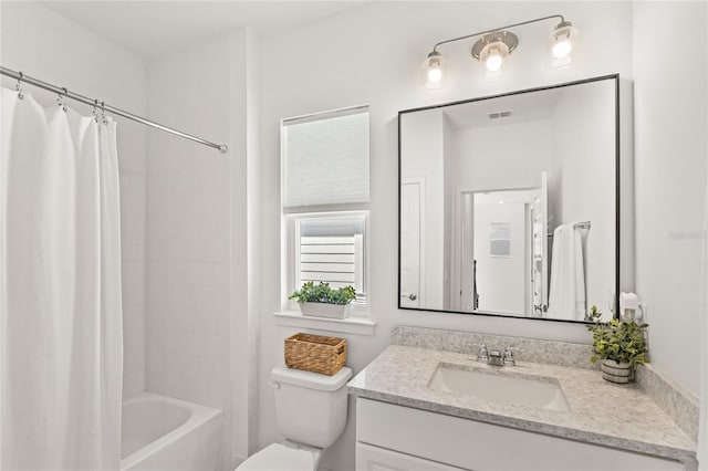 full bathroom featuring toilet, visible vents, shower / bath combo with shower curtain, and vanity