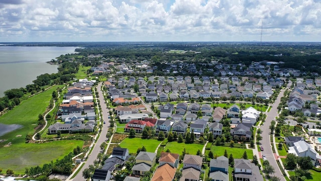 bird's eye view featuring a residential view and a water view