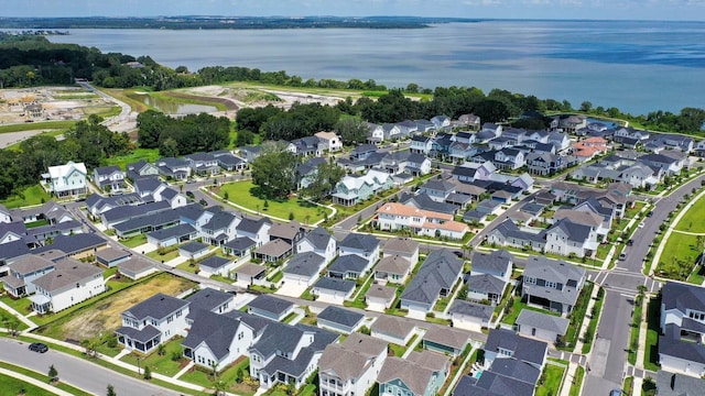 bird's eye view with a water view and a residential view